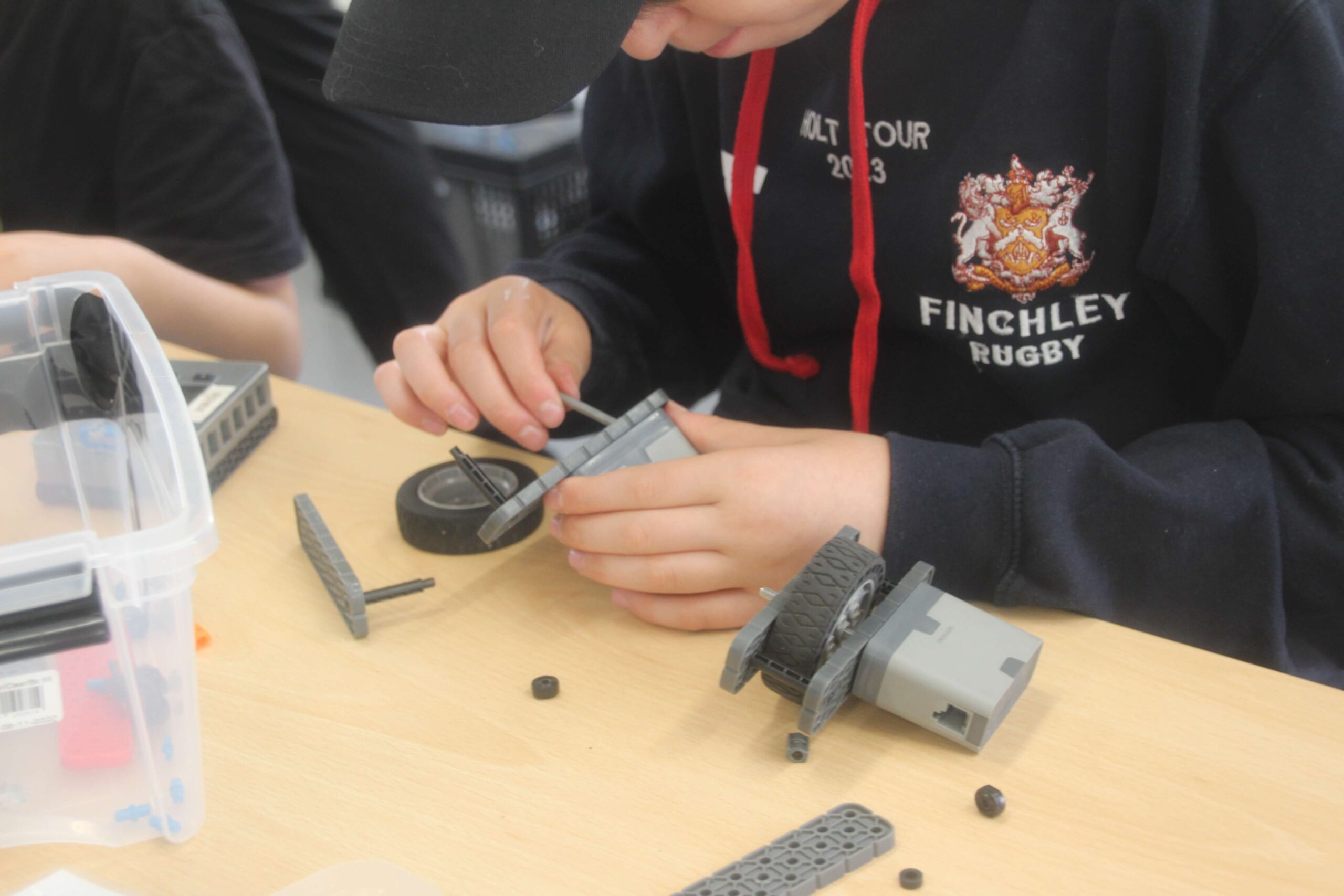 Child building a VEX IQ robot